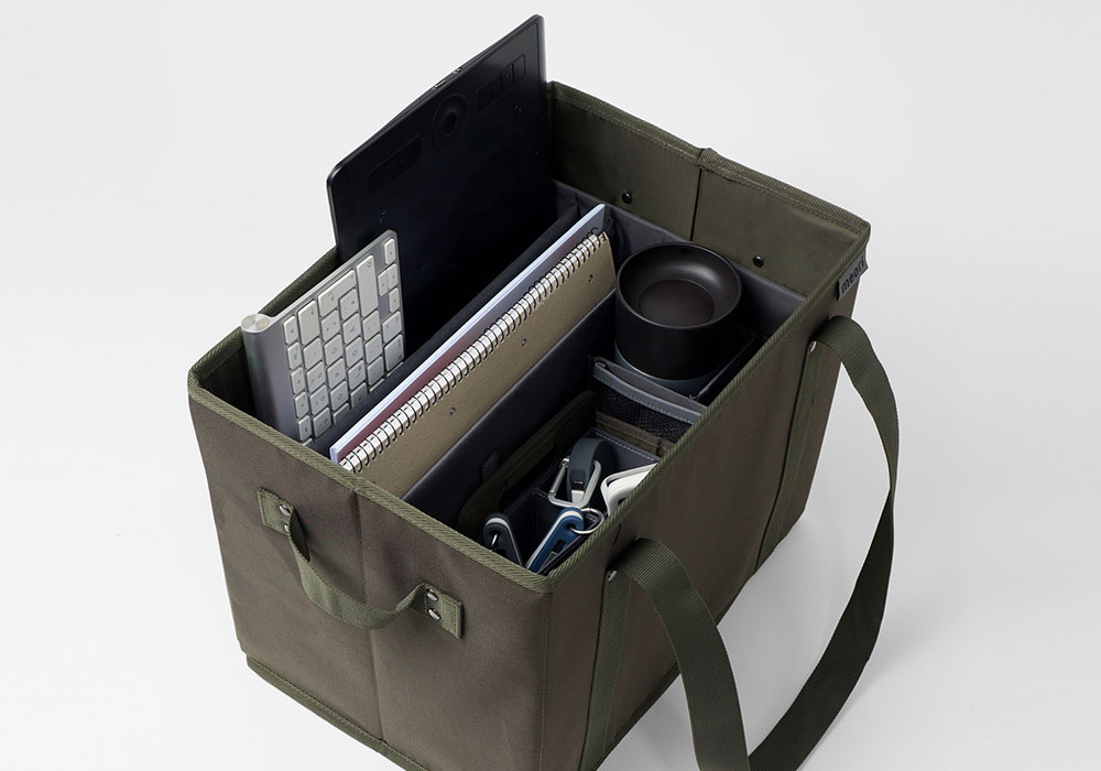 Olive meori Officeboxen mit Tragegurt und Inhalt im Einsatz